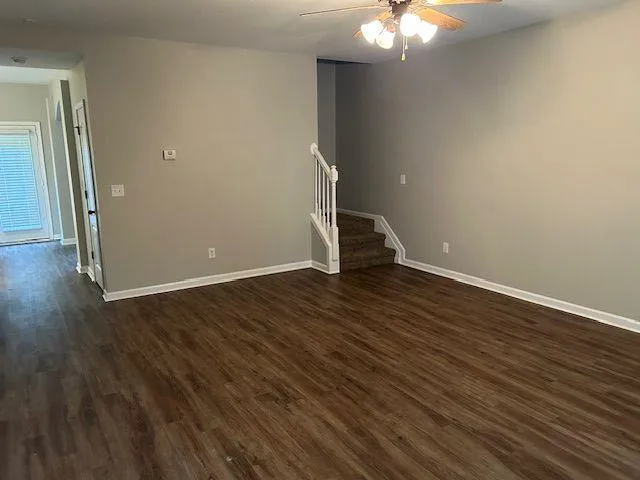 a view of an empty room with a window