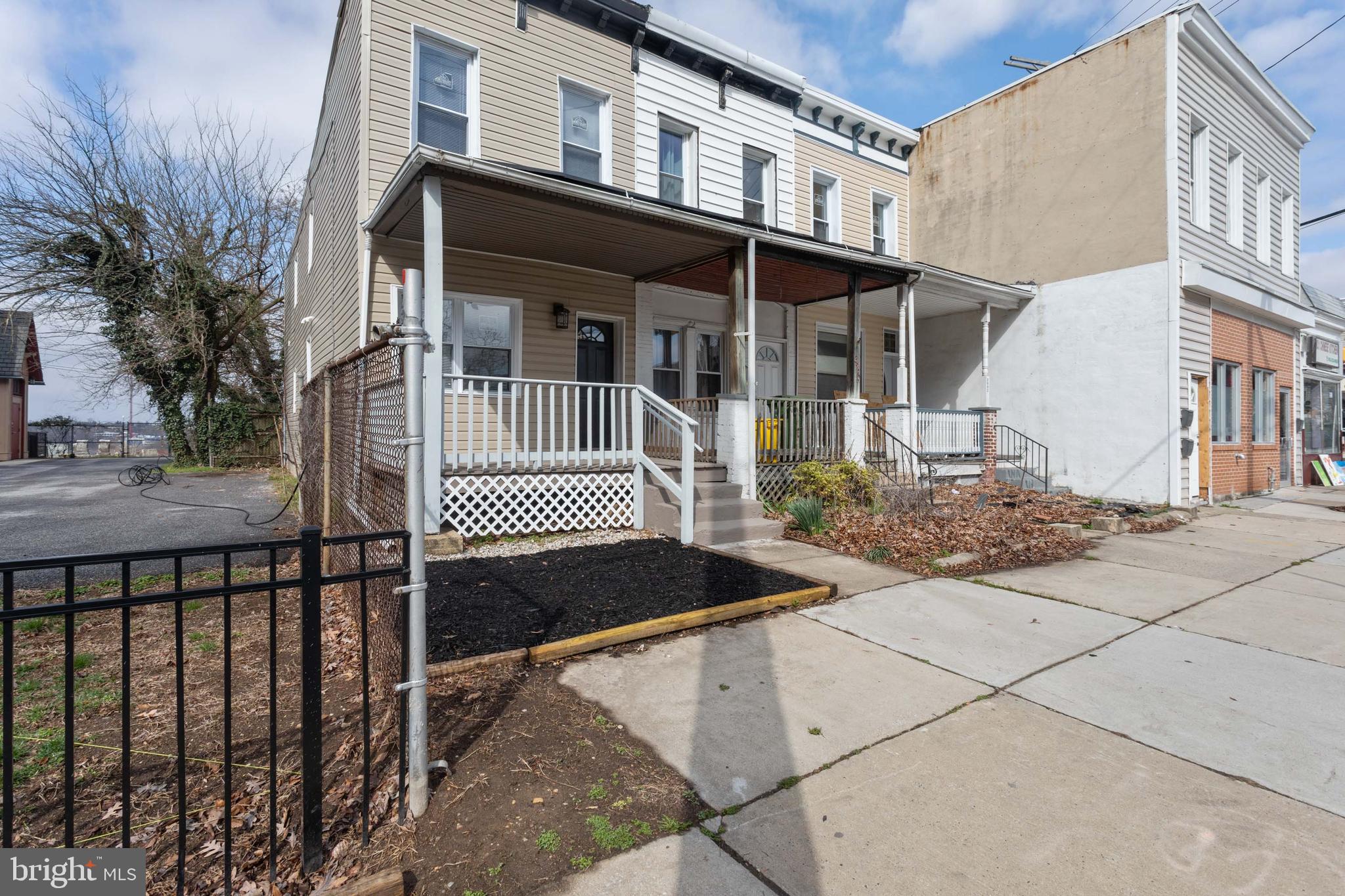 3988 Roland Avenue Baltimore, MD 21211 - Photo 2 of 31 a front view of a house with a porch