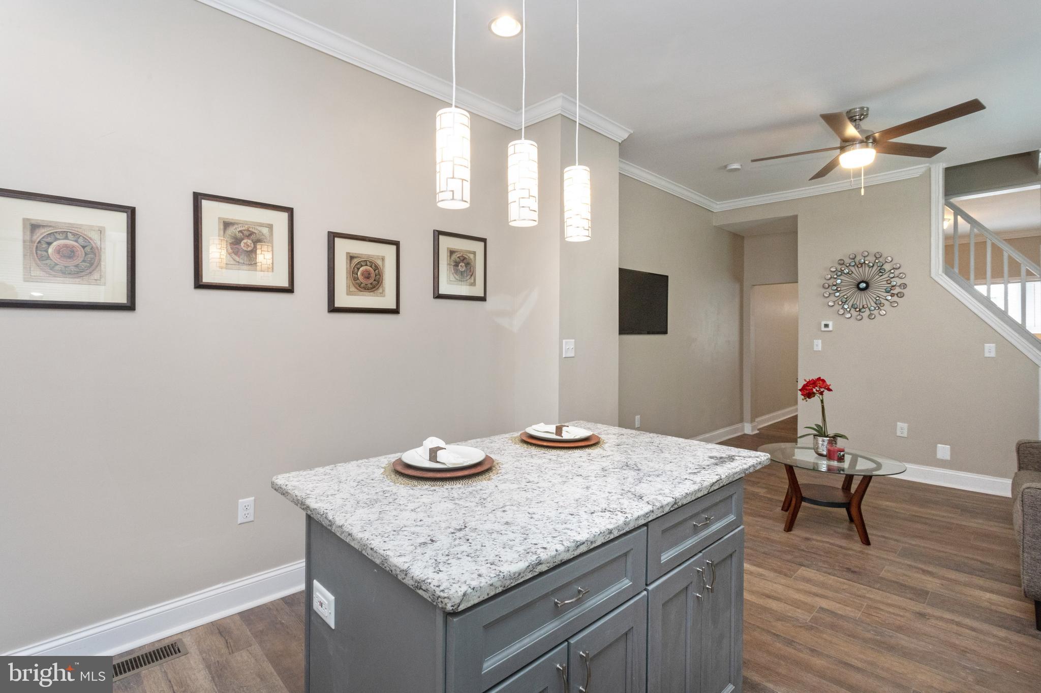 3988 Roland Avenue Baltimore, MD 21211 - Photo 13 of 31 a kitchen with a table and chairs