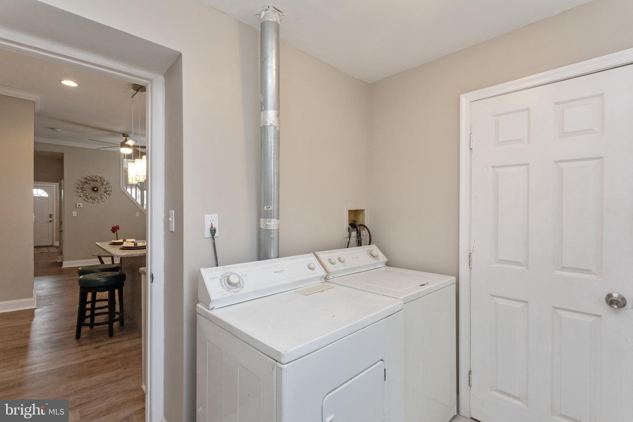 3988 Roland Avenue Baltimore, MD 21211 - Photo 15 of 31 a utility room with dryer and washer