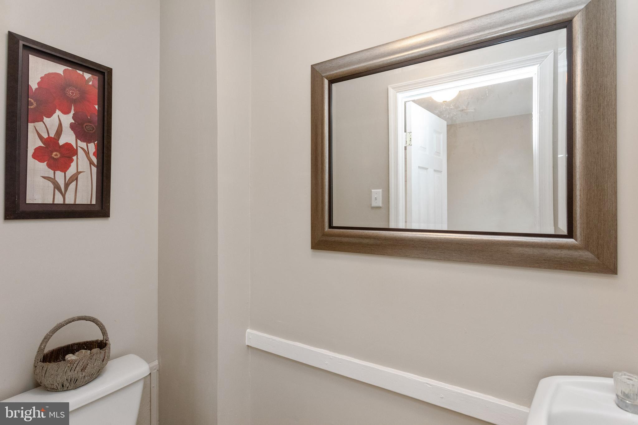 3988 Roland Avenue Baltimore, MD 21211 - Photo 16 of 31 a bathroom with a toilet and a sink
