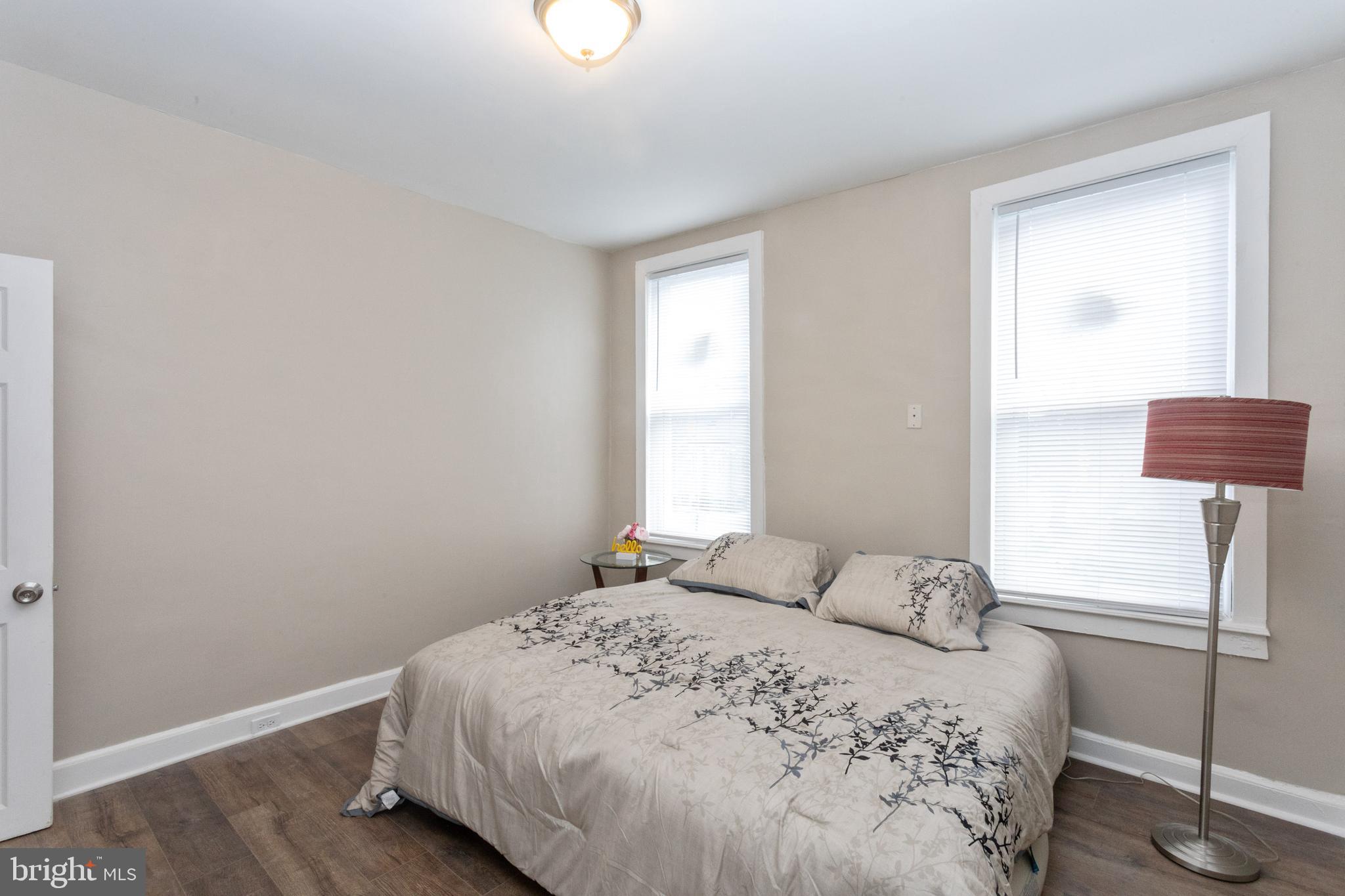 3988 Roland Avenue Baltimore, MD 21211 - Photo 17 of 31 a bedroom with a bed and a window