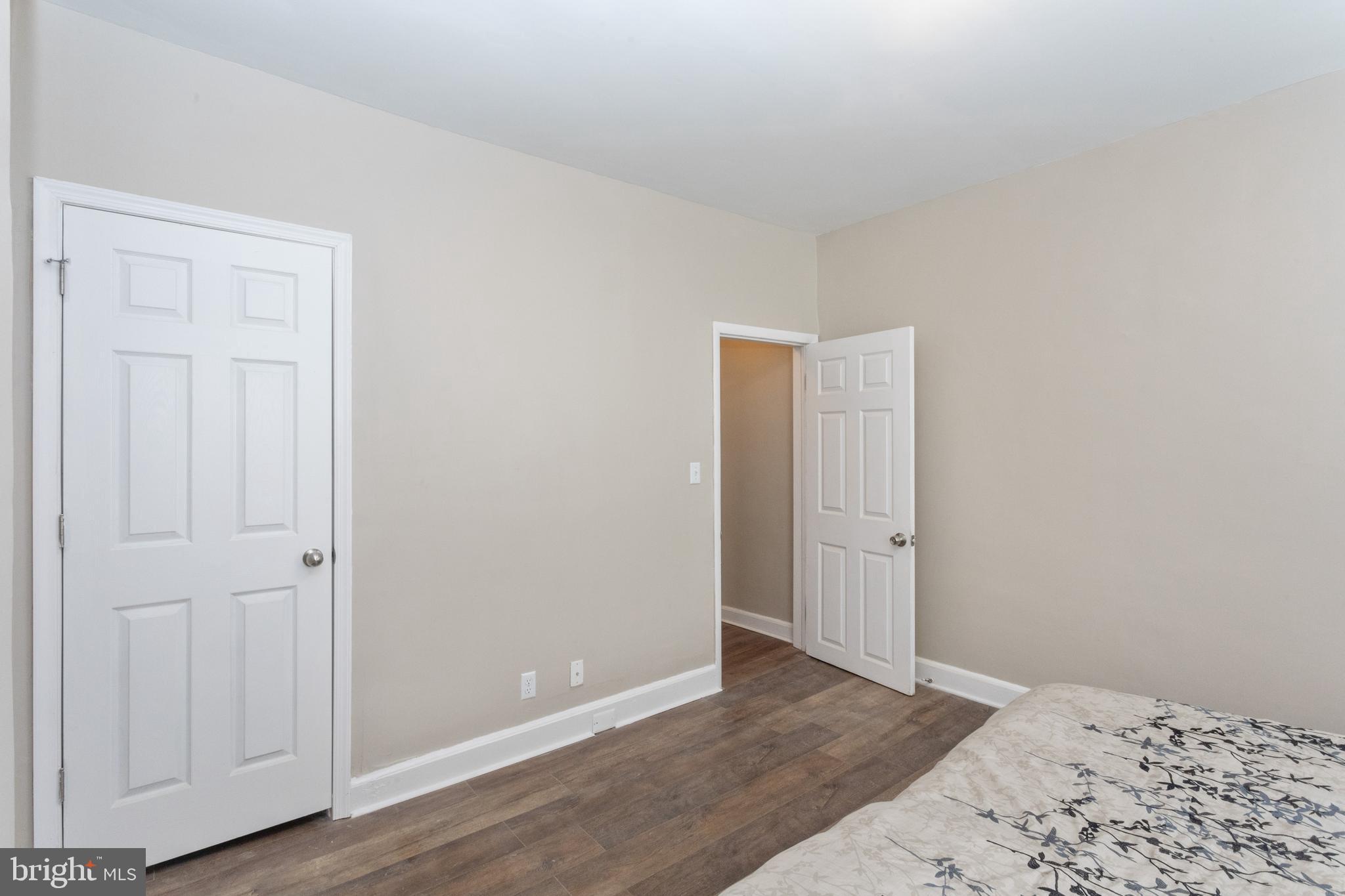 3988 Roland Avenue Baltimore, MD 21211 - Photo 19 of 31 an empty room with wooden floor and closet