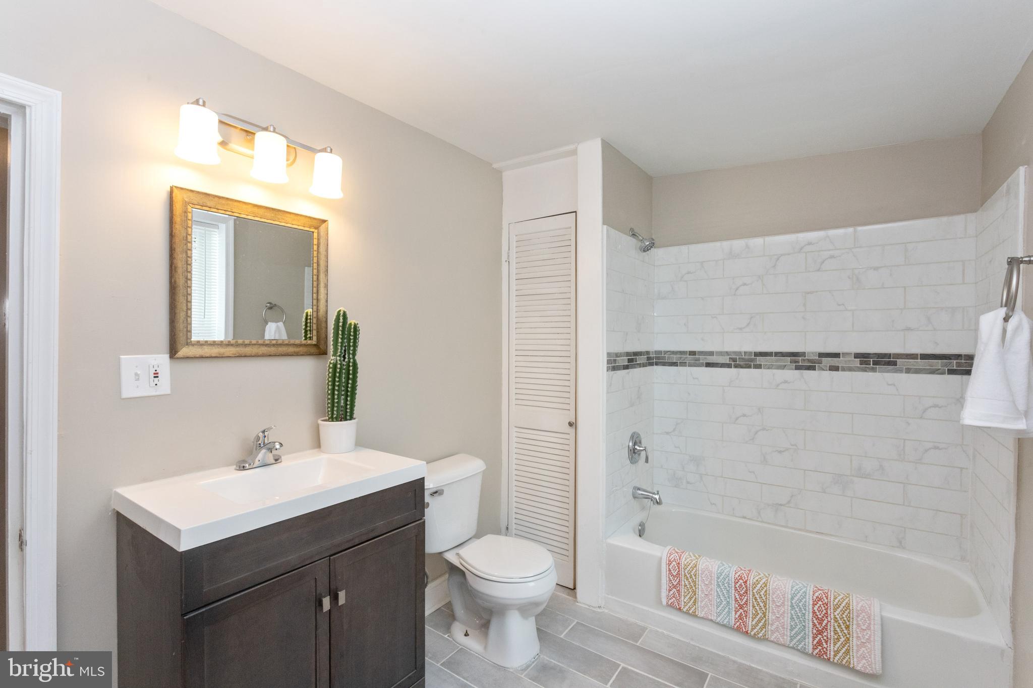 3988 Roland Avenue Baltimore, MD 21211 - Photo 24 of 31 a bathroom with a sink toilet and shower