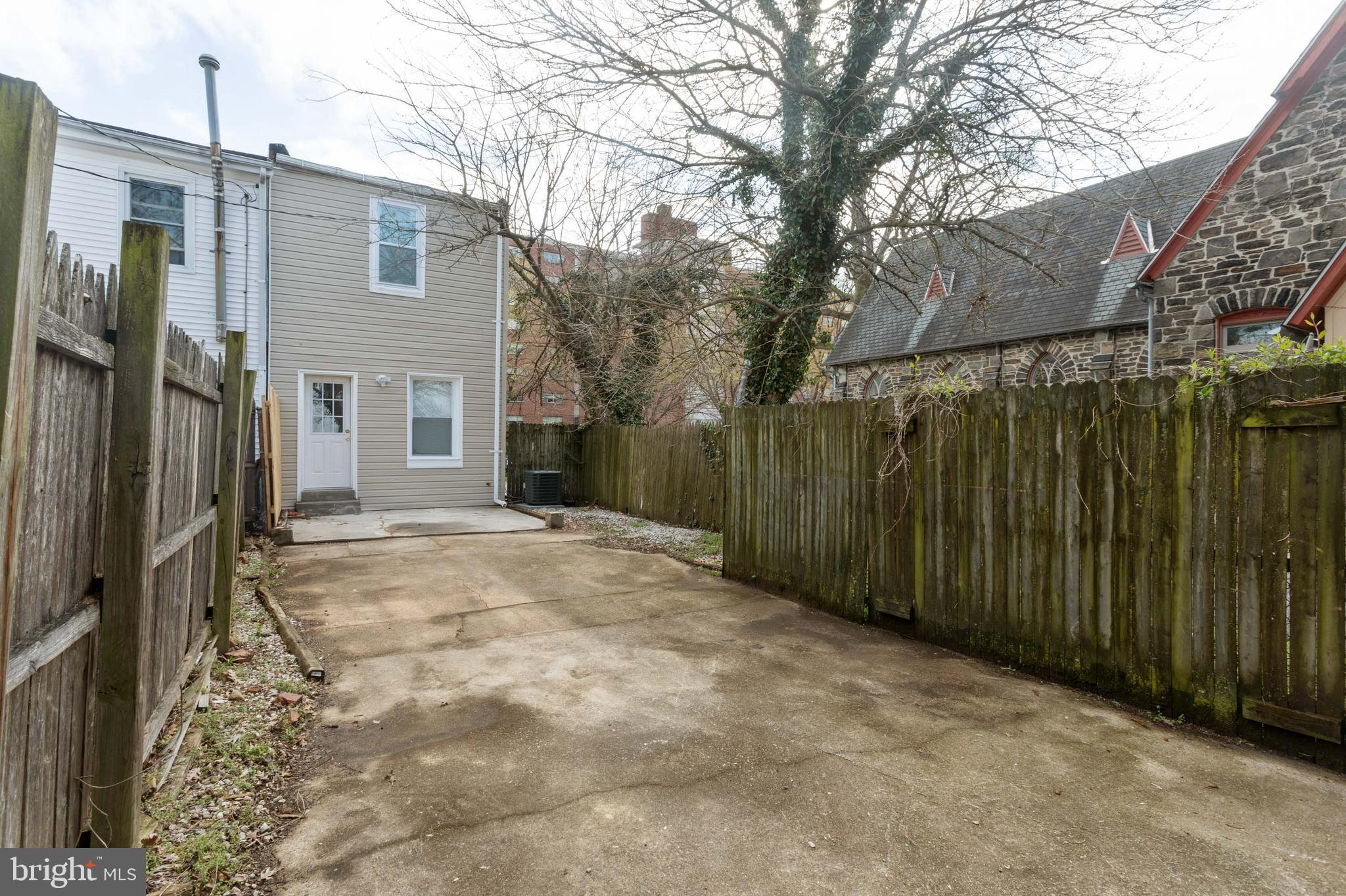 3988 Roland Avenue Baltimore, MD 21211 - Photo 29 of 31 a view of a house with a backyard