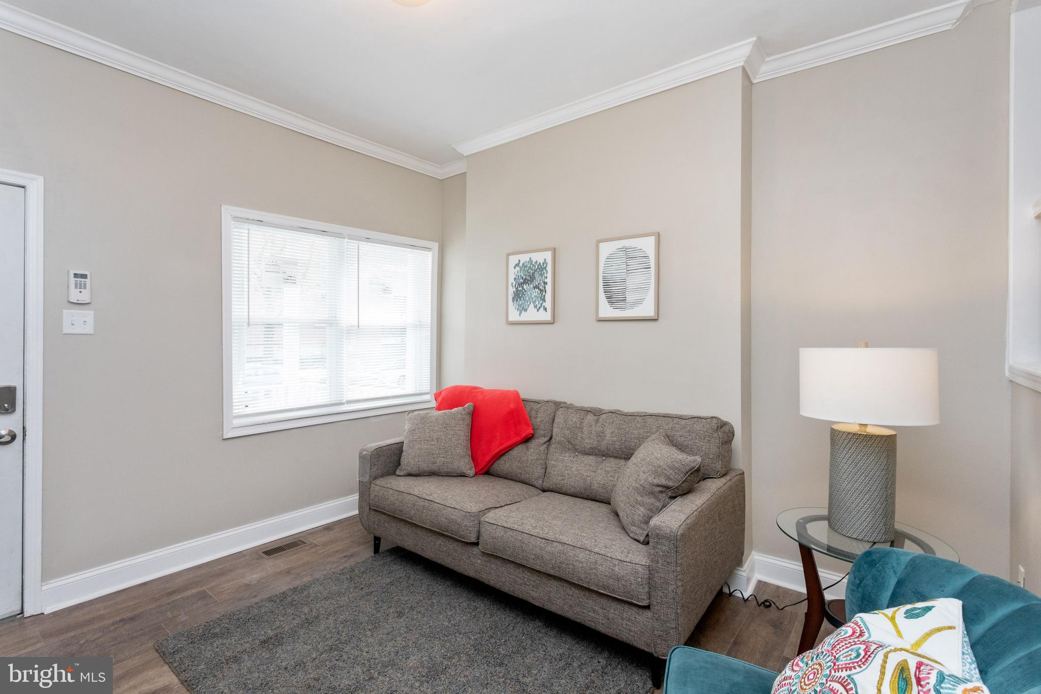 3988 Roland Avenue Baltimore, MD 21211 - Photo 7 of 31 a living room with furniture and a window