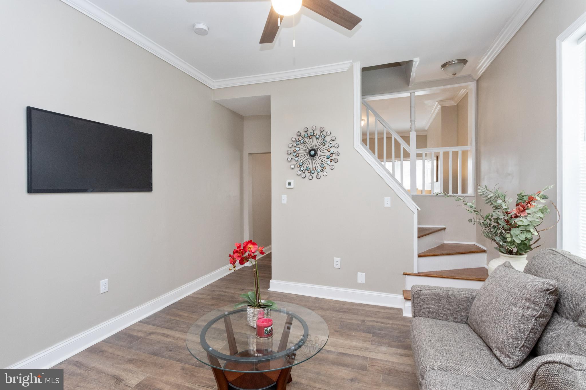 3988 Roland Avenue Baltimore, MD 21211 - Photo 10 of 31 a living room with furniture and a flat screen tv