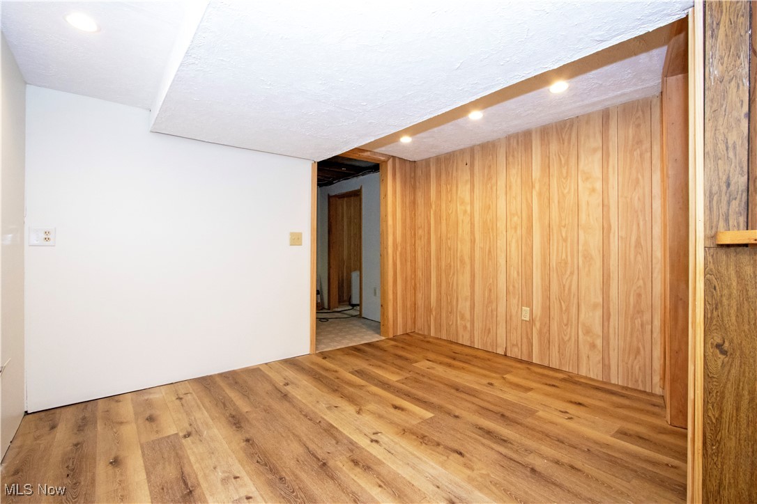 2276 Schellin Road Wooster, OH 44691 - Photo 24 of 48 Unfurnished room with recessed lighting, wood finished floors, and wooden walls