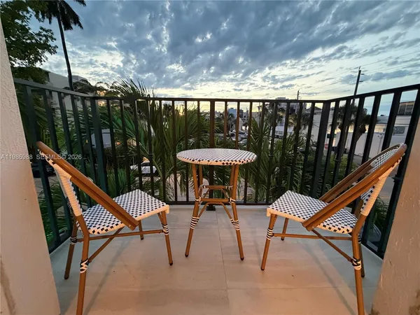 a balcony with chairs
