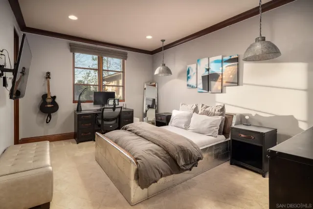 a spacious bedroom with a large bed and a window