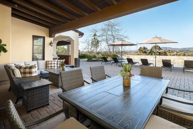 a outdoor dining space with wooden floor