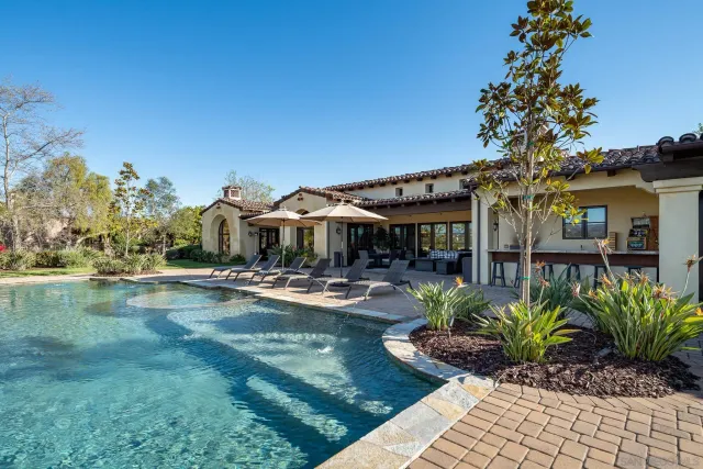 a view of a swimming pool with a patio