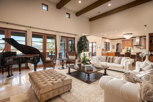 a living room with furniture wooden floor and windows