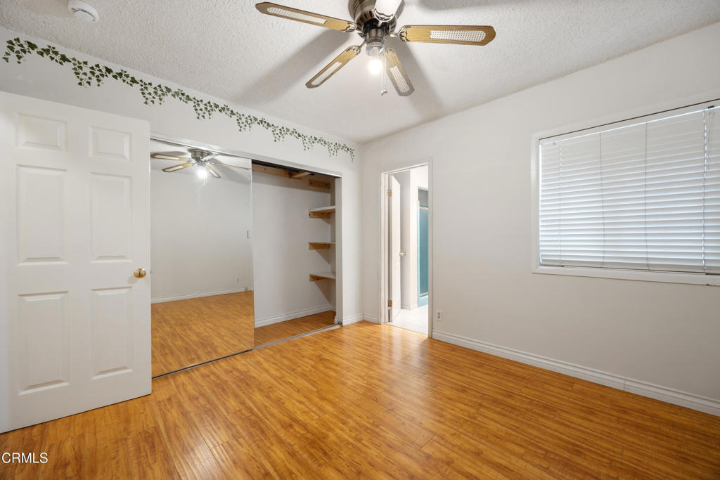 6940 Bellclaire Street Tujunga, CA 91042 - Photo 17 of 47 a view of empty room with wooden floor