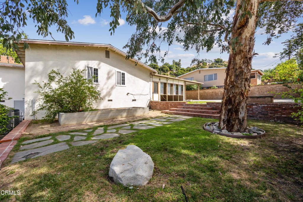 6940 Bellclaire Street Tujunga, CA 91042 - Photo 29 of 47 a view of a house with backyard