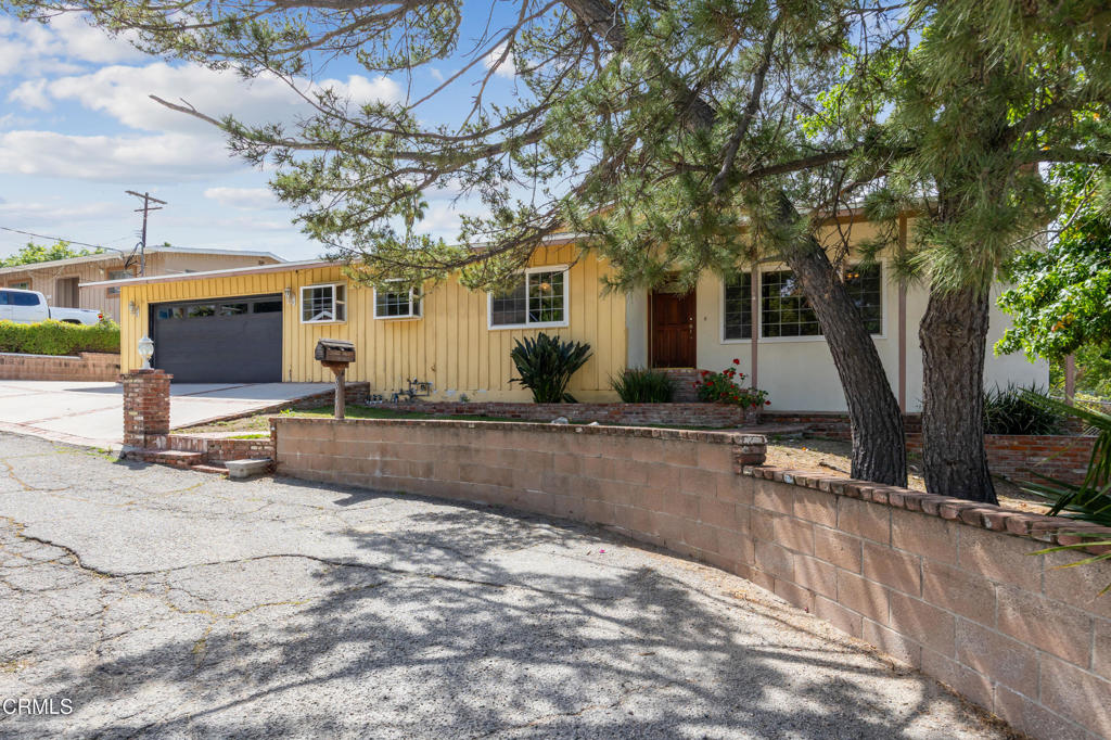 6940 Bellclaire Street Tujunga, CA 91042 - Photo 3 of 47 a view of a house with swimming pool and sitting area
