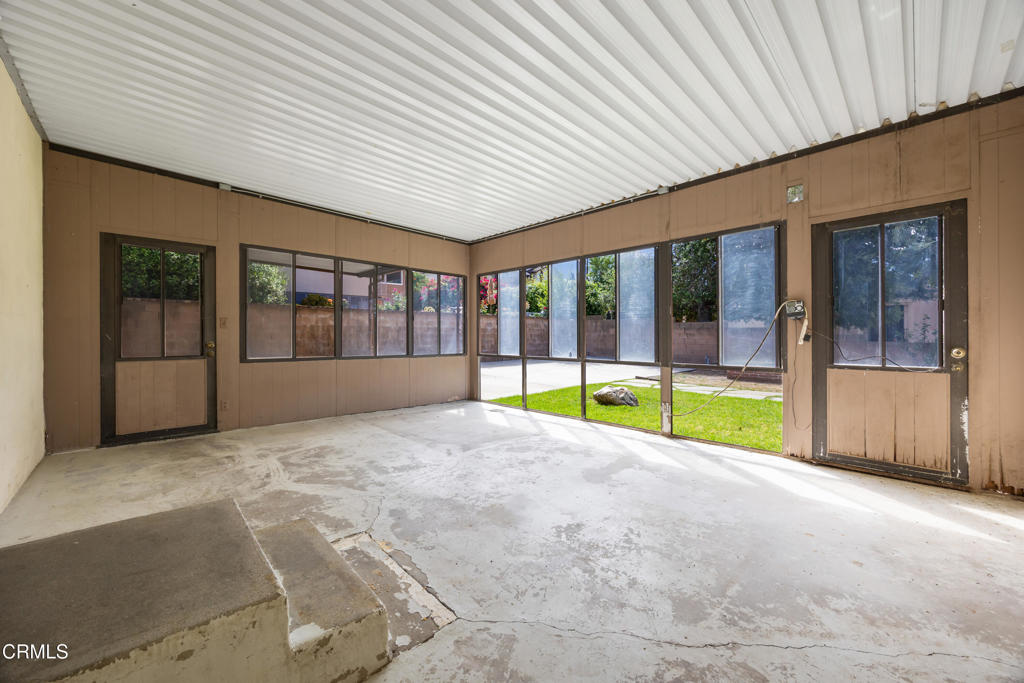 6940 Bellclaire Street Tujunga, CA 91042 - Photo 34 of 47 a view of an empty room with a fireplace
