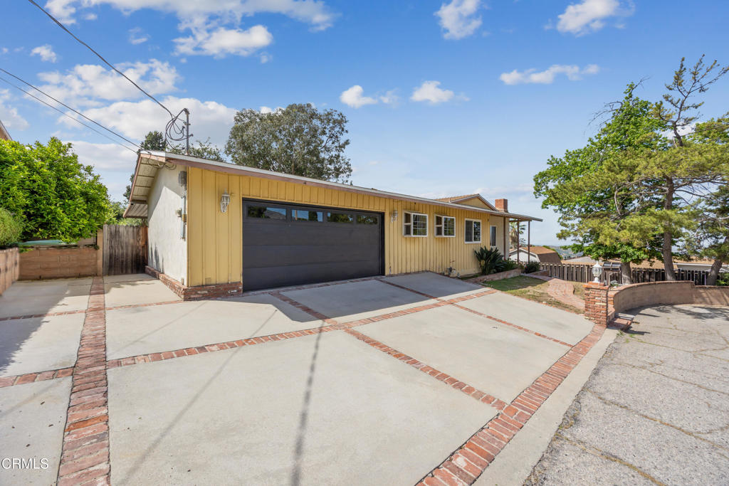 6940 Bellclaire Street Tujunga, CA 91042 - Photo 38 of 47 a front view of a house with a yard