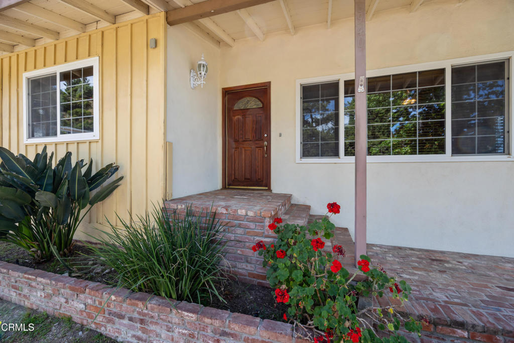 6940 Bellclaire Street Tujunga, CA 91042 - Photo 6 of 47 a flower plants in front of a house