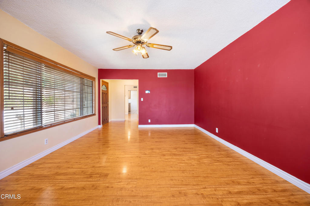 6940 Bellclaire Street Tujunga, CA 91042 - Photo 8 of 47 a view of an empty room with a window