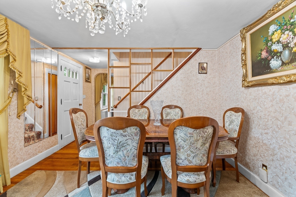 100 Maple Street Framingham, MA 01702 - Photo 8 of 42 a view of a dining room with furniture and wooden floor