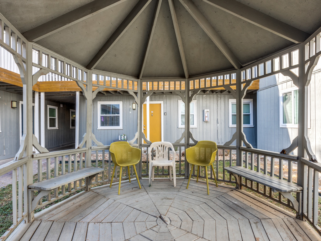 2401 Manor Road, Unit 218 Austin, TX 78722 - Photo 11 of 27 An inviting gazebo with built-in benches offers a serene outdoor retreat.