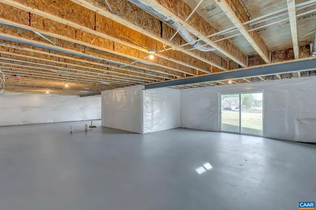 a view of an empty room with stairs