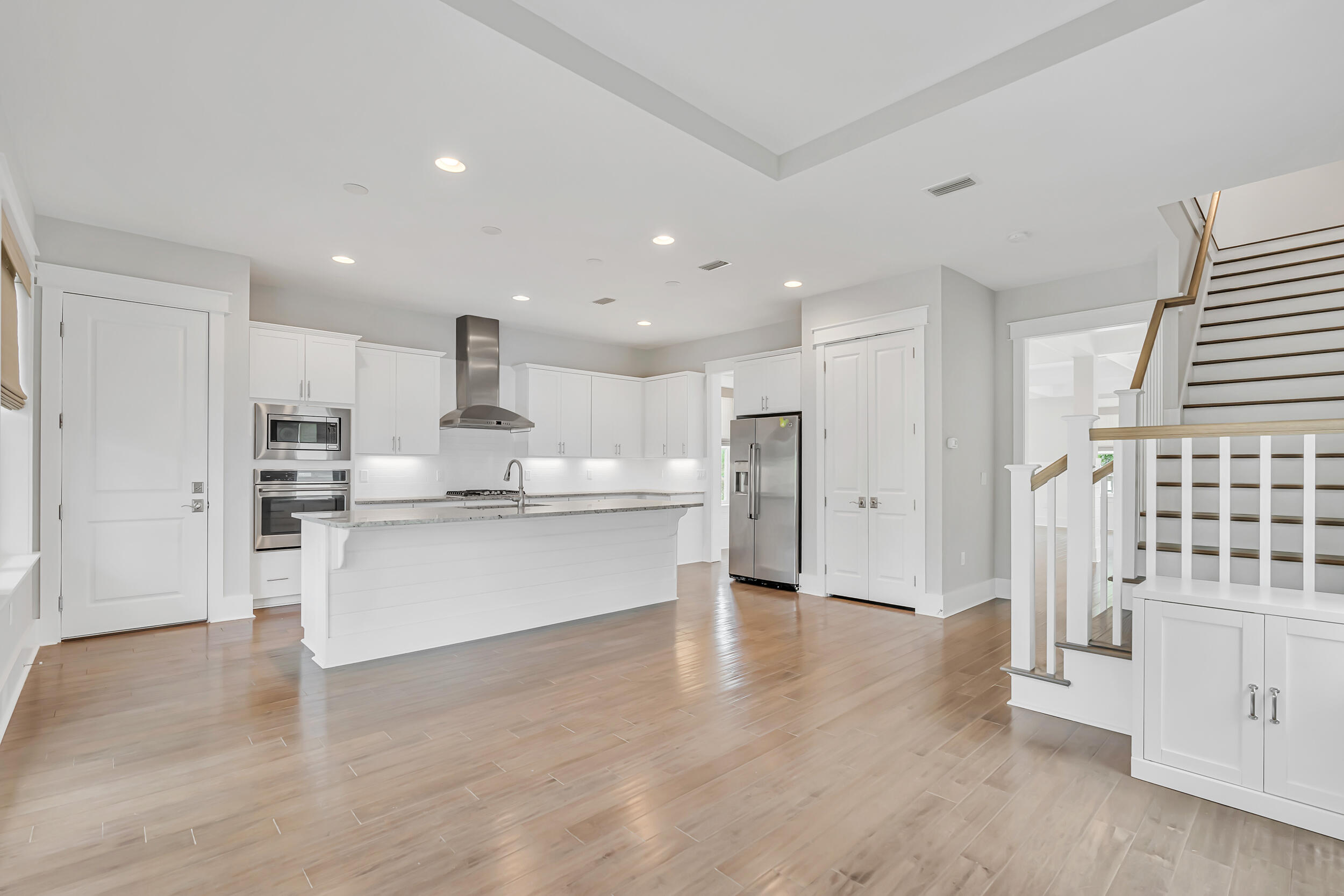 345 Flatwoods Forest Loop Santa Rosa Beach, FL 32459 - Photo 12 of 62 a large kitchen with stainless steel appliances granite countertop a large counter top a sink and a refrigerator