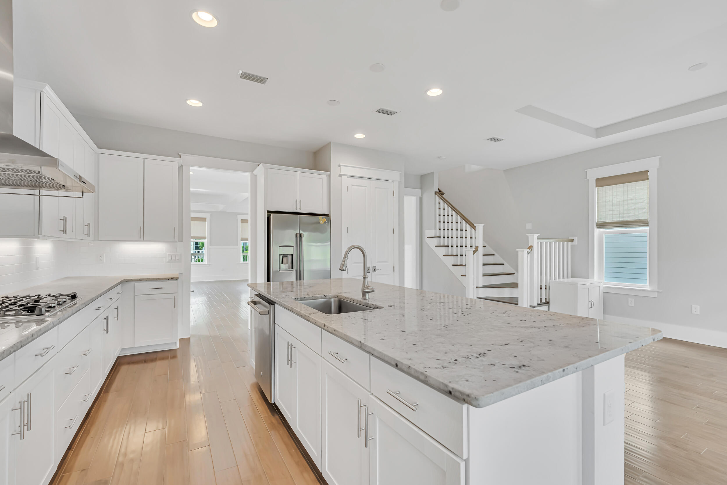 345 Flatwoods Forest Loop Santa Rosa Beach, FL 32459 - Photo 13 of 62 a kitchen with stainless steel appliances granite countertop a sink a stove and a refrigerator