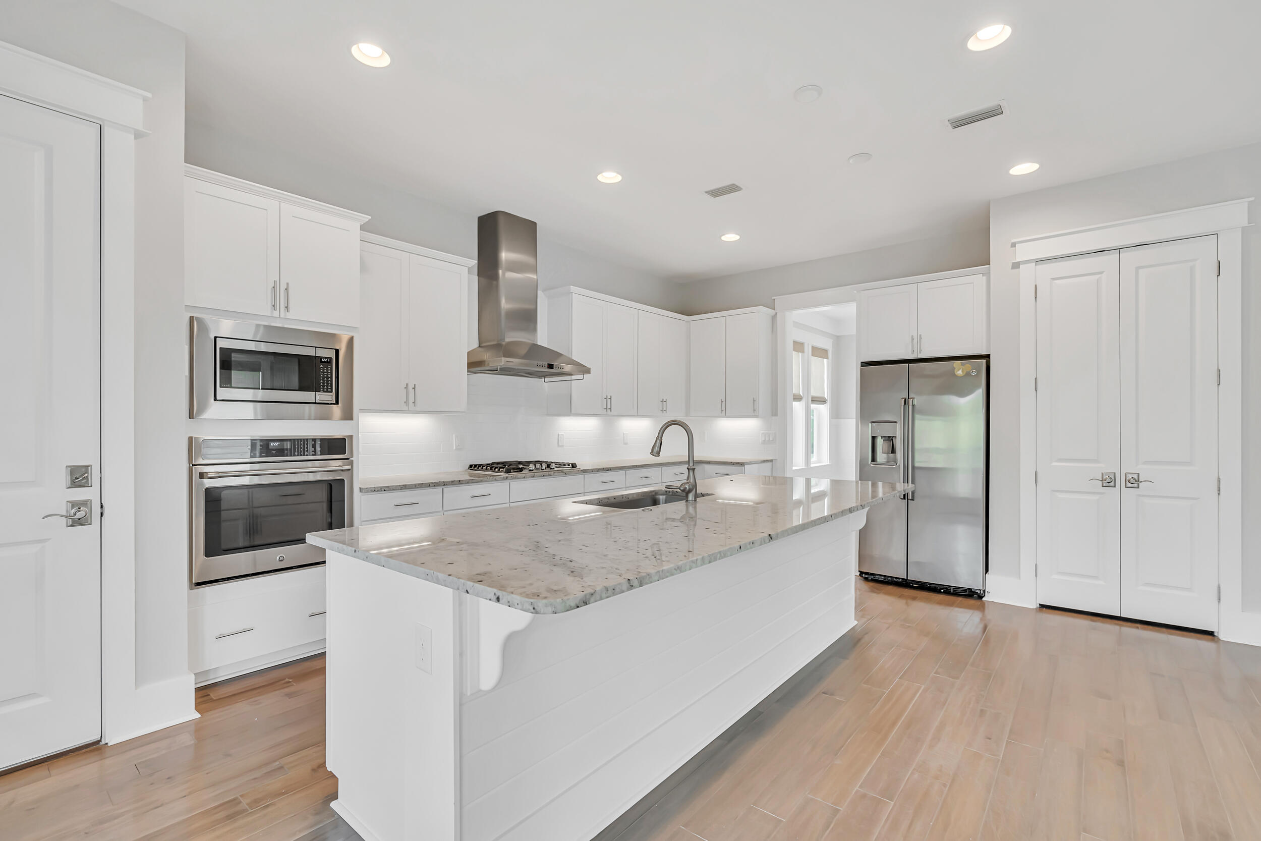 345 Flatwoods Forest Loop Santa Rosa Beach, FL 32459 - Photo 16 of 62 a kitchen with stainless steel appliances granite countertop a refrigerator a sink and a stove