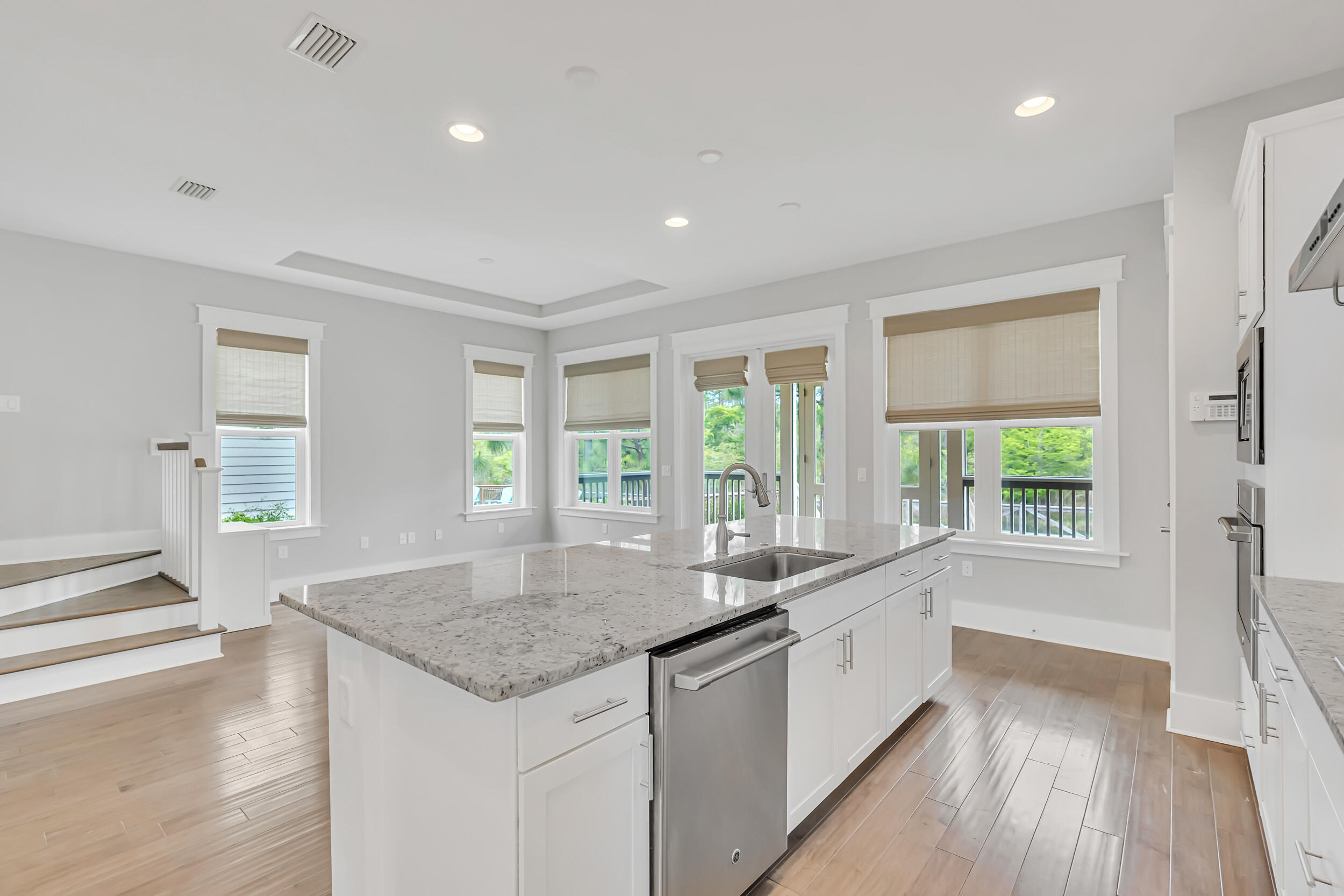 345 Flatwoods Forest Loop Santa Rosa Beach, FL 32459 - Photo 17 of 62 a large white kitchen with granite countertop a large window and a sink