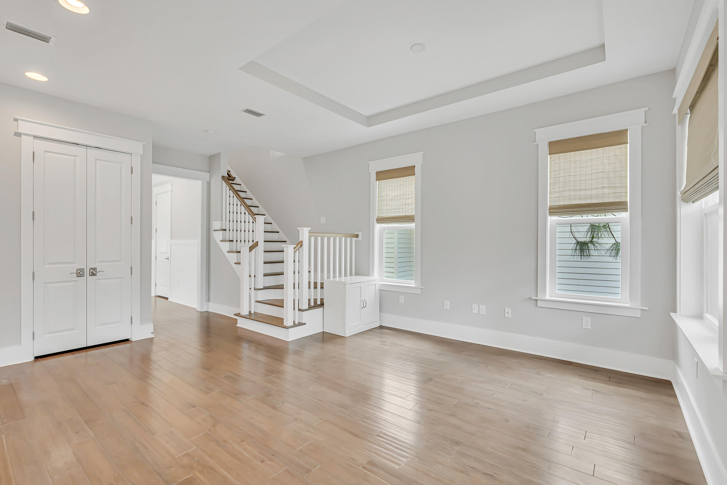 345 Flatwoods Forest Loop Santa Rosa Beach, FL 32459 - Photo 20 of 62 an empty room with wooden floor and windows