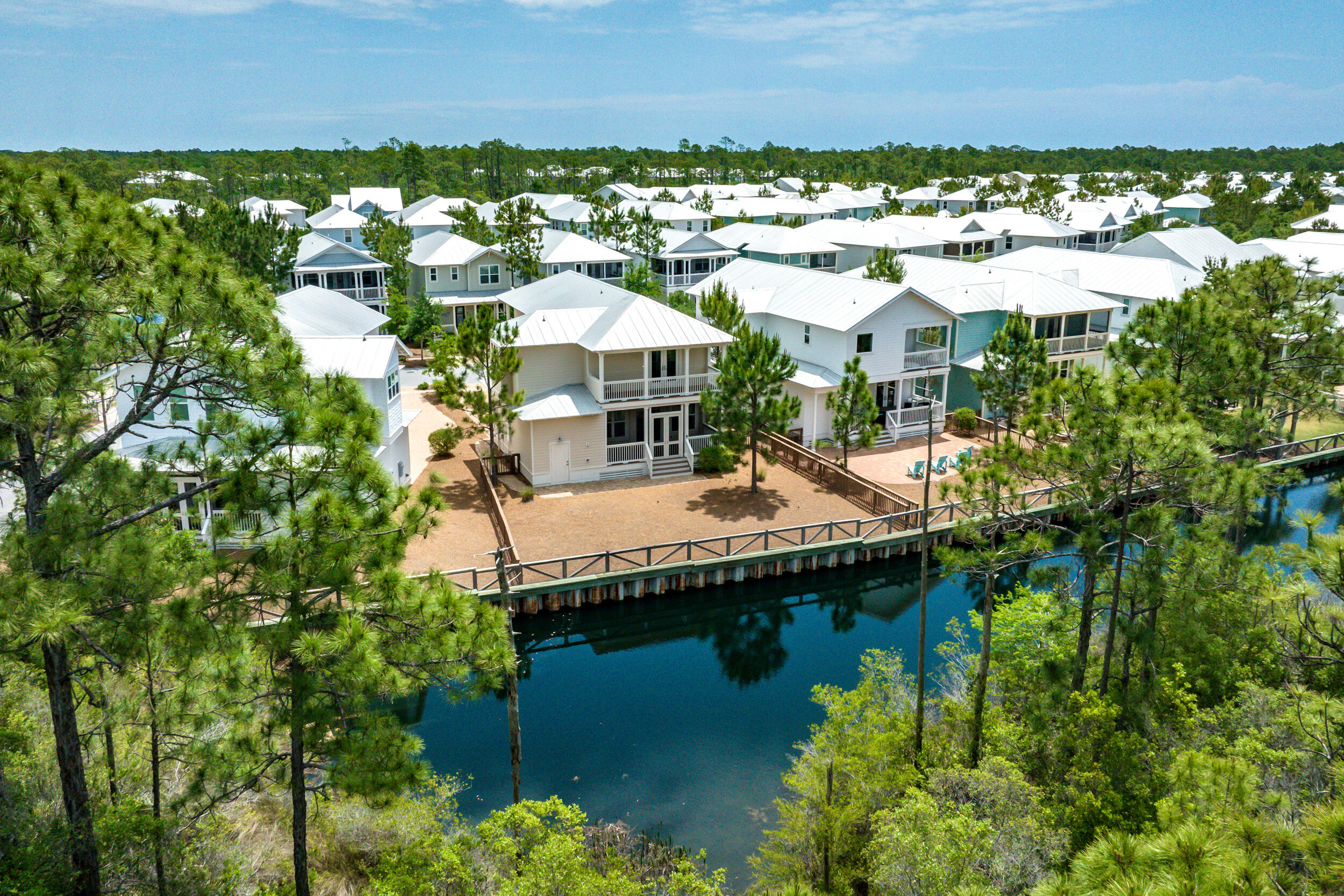 345 Flatwoods Forest Loop Santa Rosa Beach, FL 32459 - Photo 2 of 62 a swimming pool with outdoor seating and yard