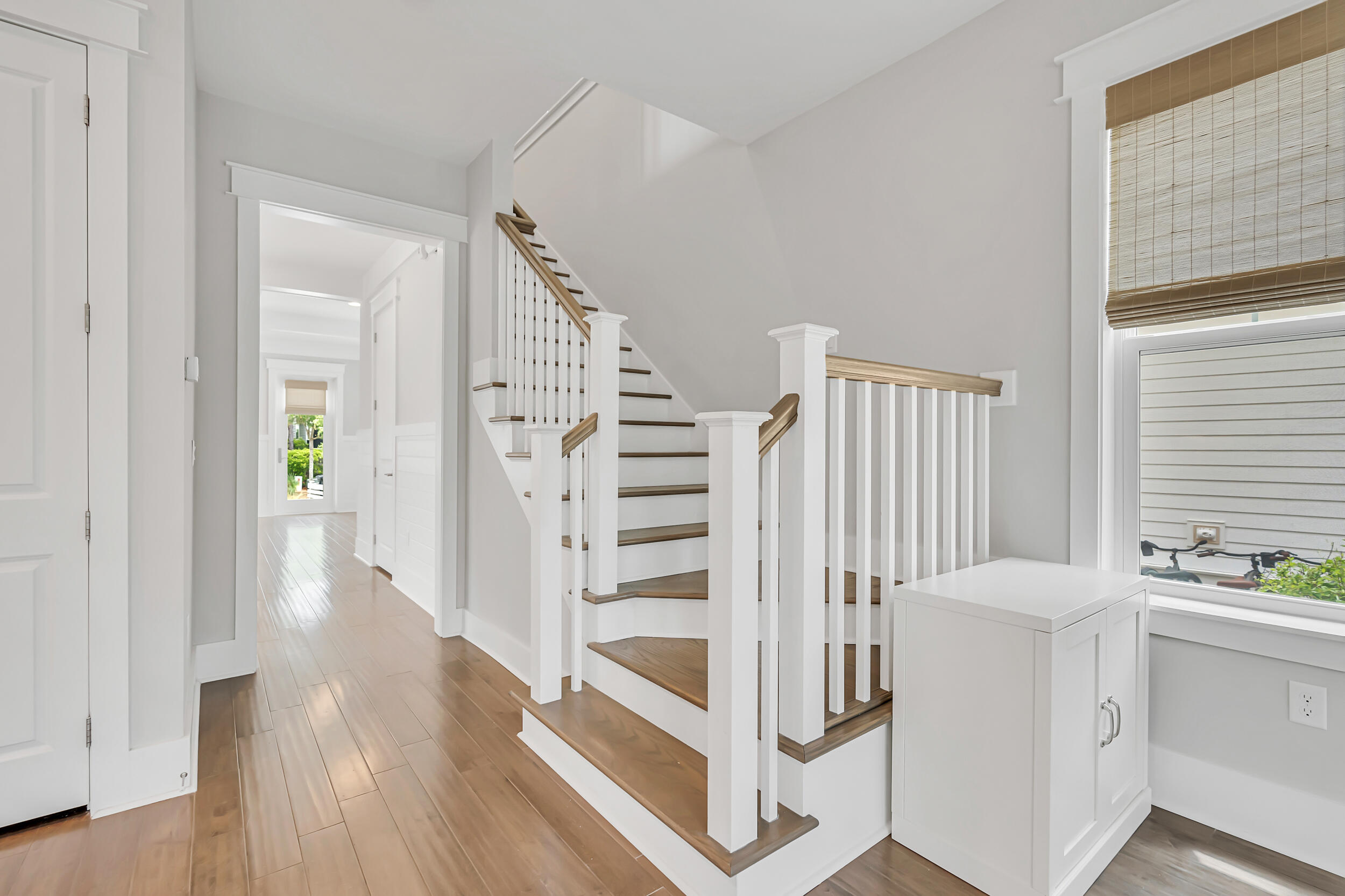 345 Flatwoods Forest Loop Santa Rosa Beach, FL 32459 - Photo 21 of 62 a view of a bedroom with wooden floor and stairs