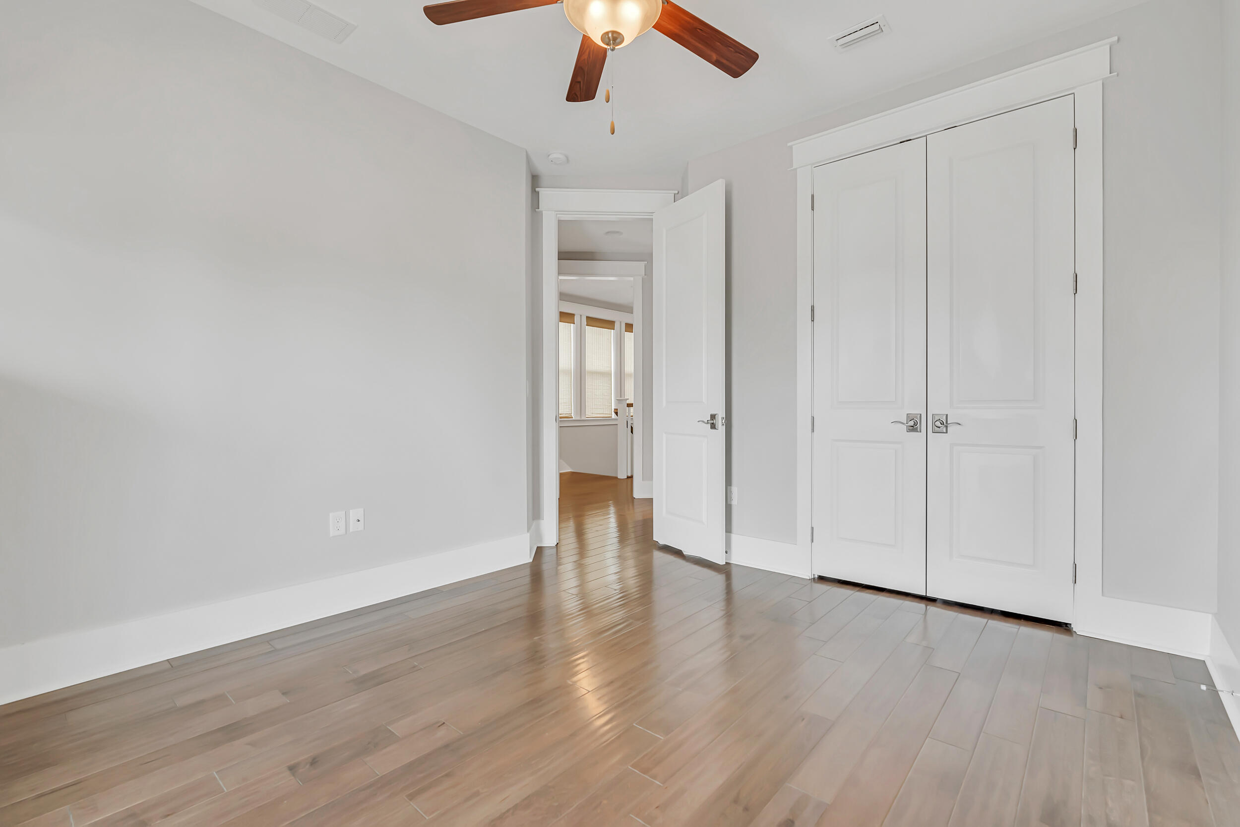 345 Flatwoods Forest Loop Santa Rosa Beach, FL 32459 - Photo 33 of 62 a view of an empty room with wooden floor