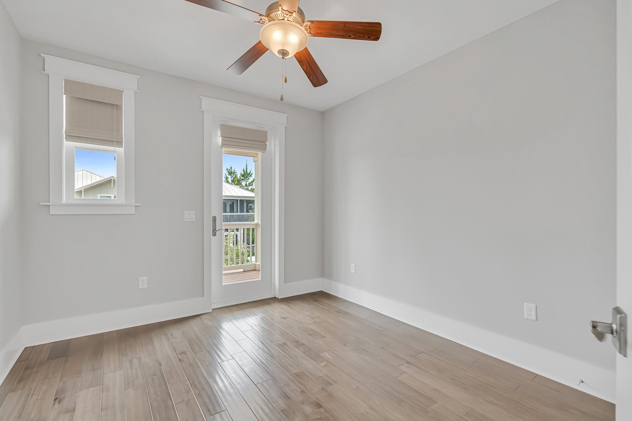 345 Flatwoods Forest Loop Santa Rosa Beach, FL 32459 - Photo 34 of 62 an empty room with windows and chandelier fan