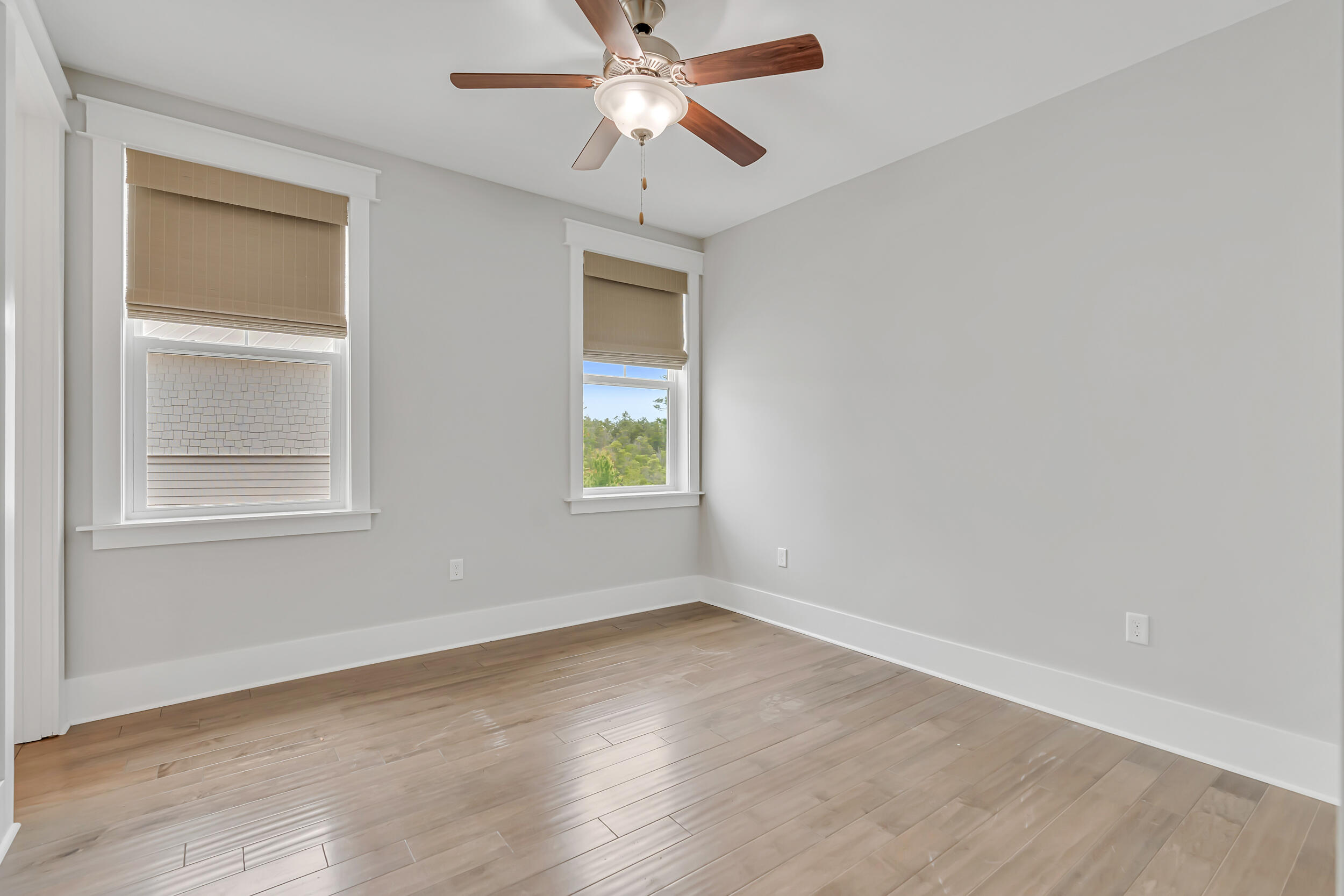345 Flatwoods Forest Loop Santa Rosa Beach, FL 32459 - Photo 37 of 62 an empty room with a window and a fan