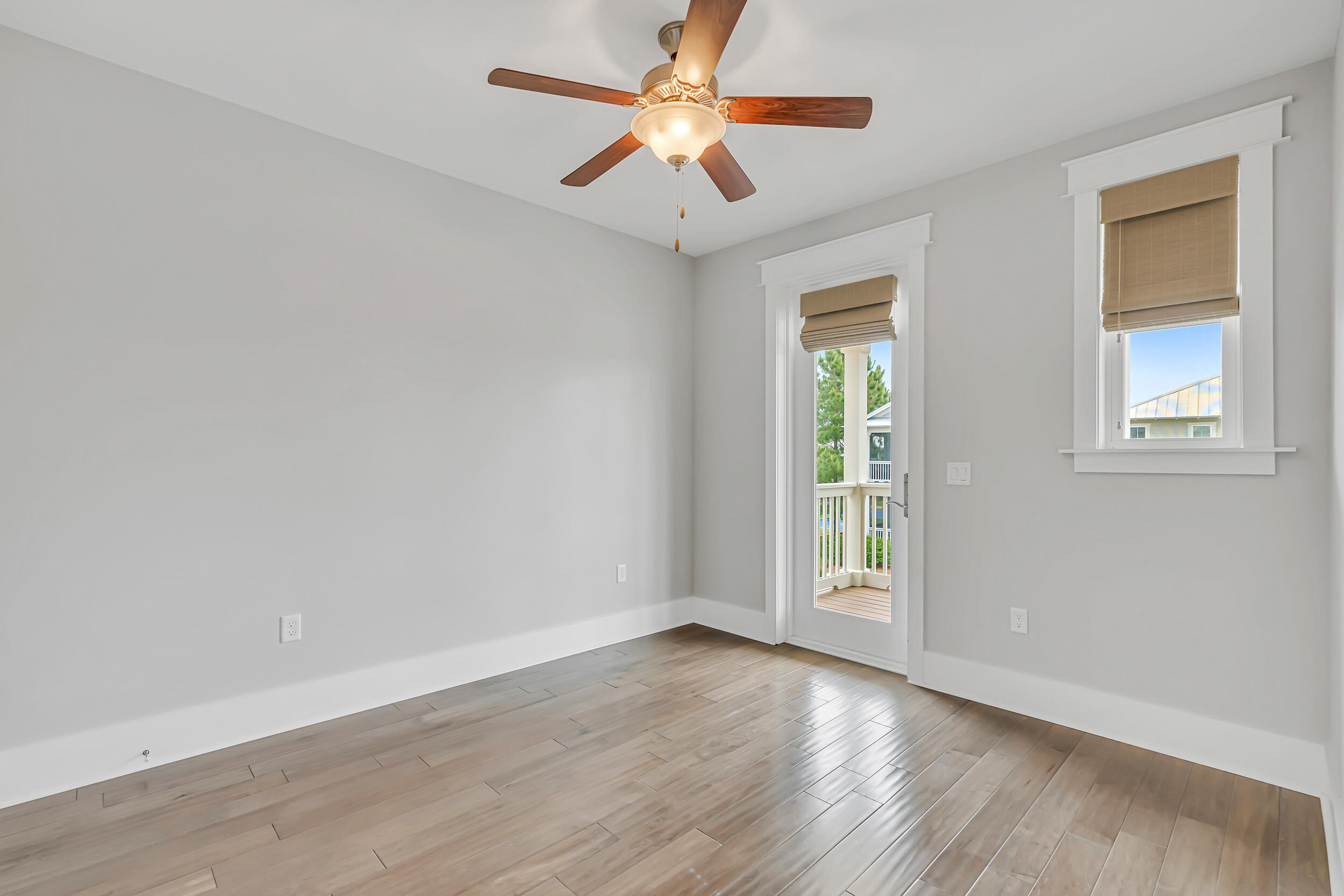 345 Flatwoods Forest Loop Santa Rosa Beach, FL 32459 - Photo 38 of 62 wooden floor in an empty room with a window