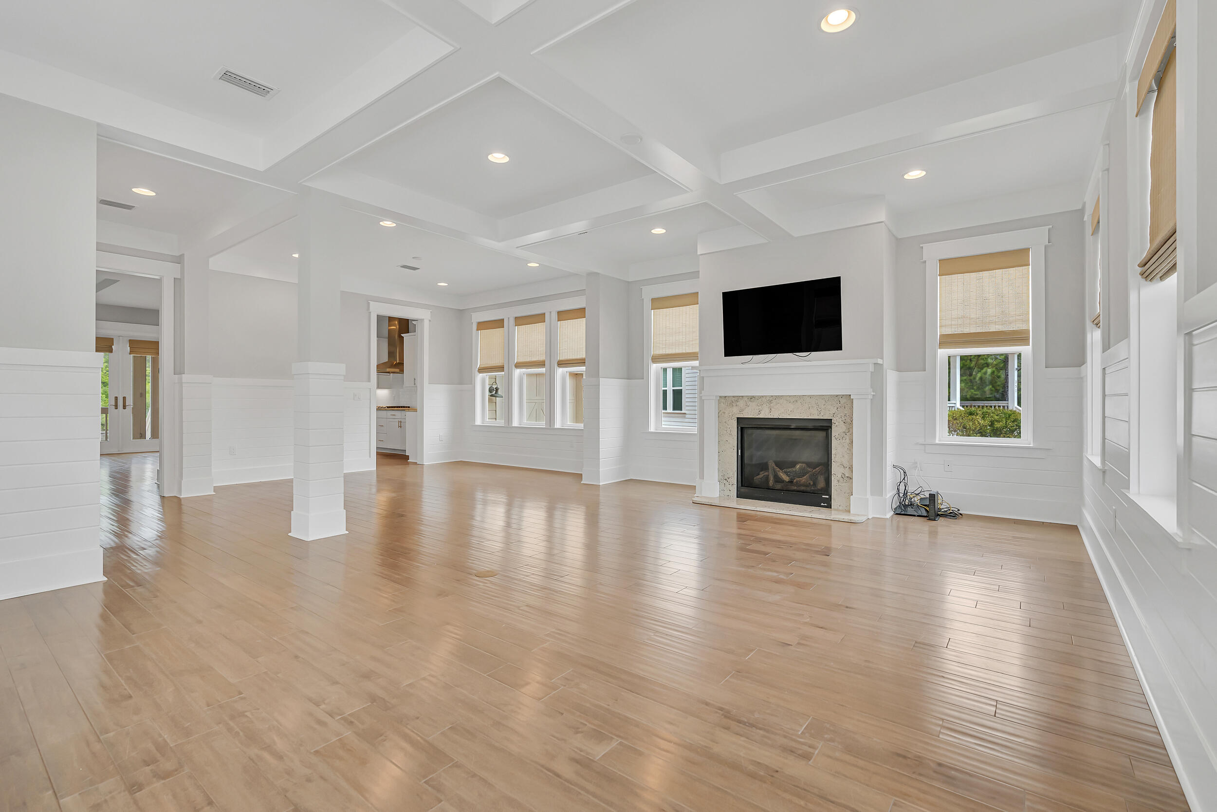 345 Flatwoods Forest Loop Santa Rosa Beach, FL 32459 - Photo 6 of 62 a view of a livingroom with fireplace wooden floor and windows