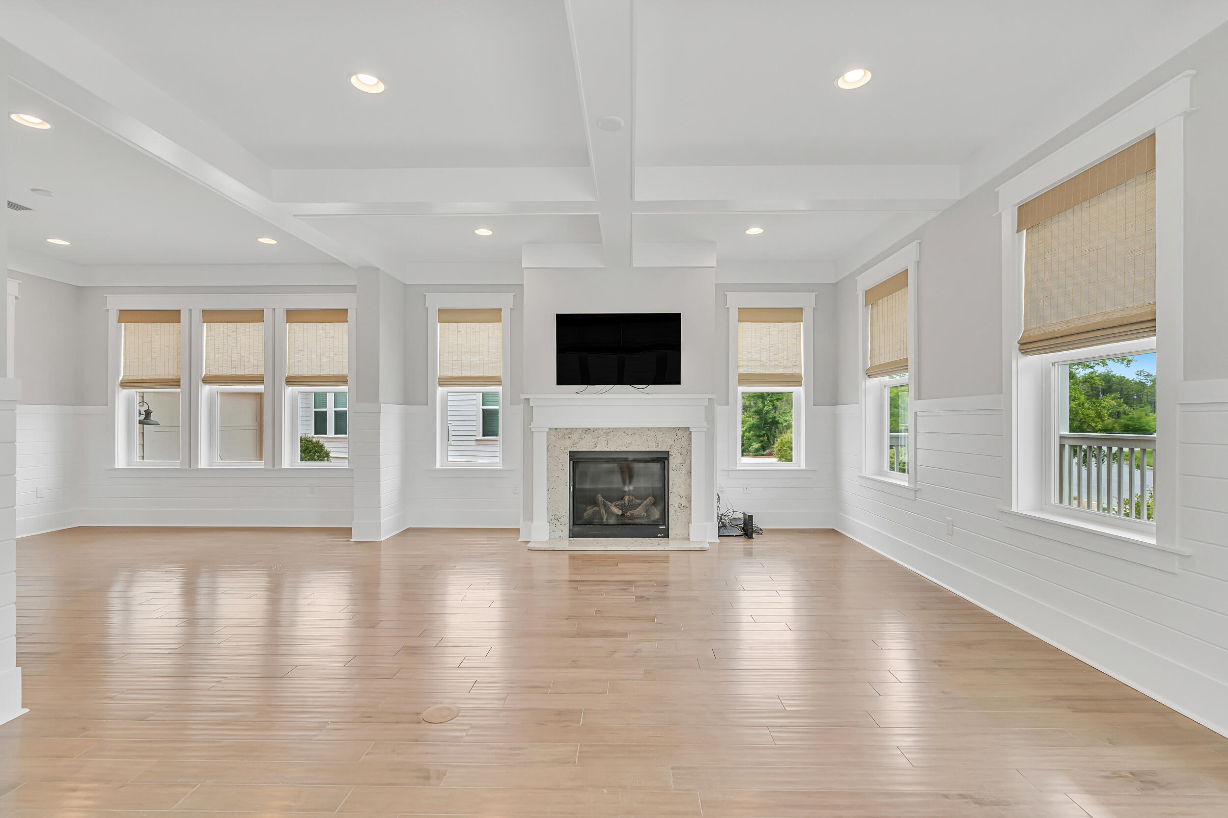 345 Flatwoods Forest Loop Santa Rosa Beach, FL 32459 - Photo 7 of 62 an empty room with windows a fireplace and a window
