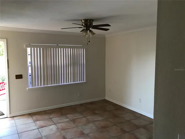 a view of an empty room with a window