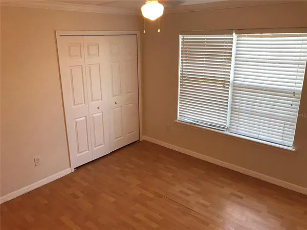 a view of a livingroom with an empty space and a window