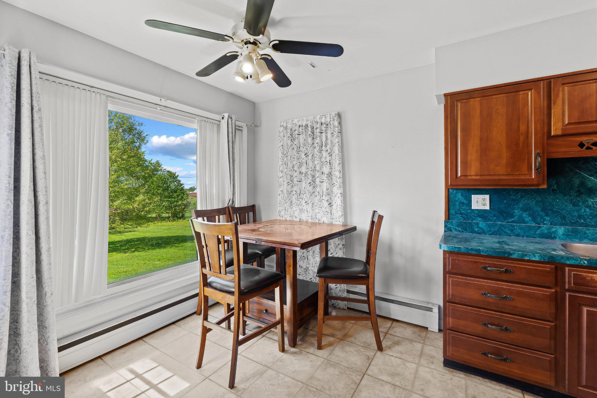 5422 Woodbine Road Woodbine, MD 21797 - Photo 13 of 39 Bright dining nook with scenic views.