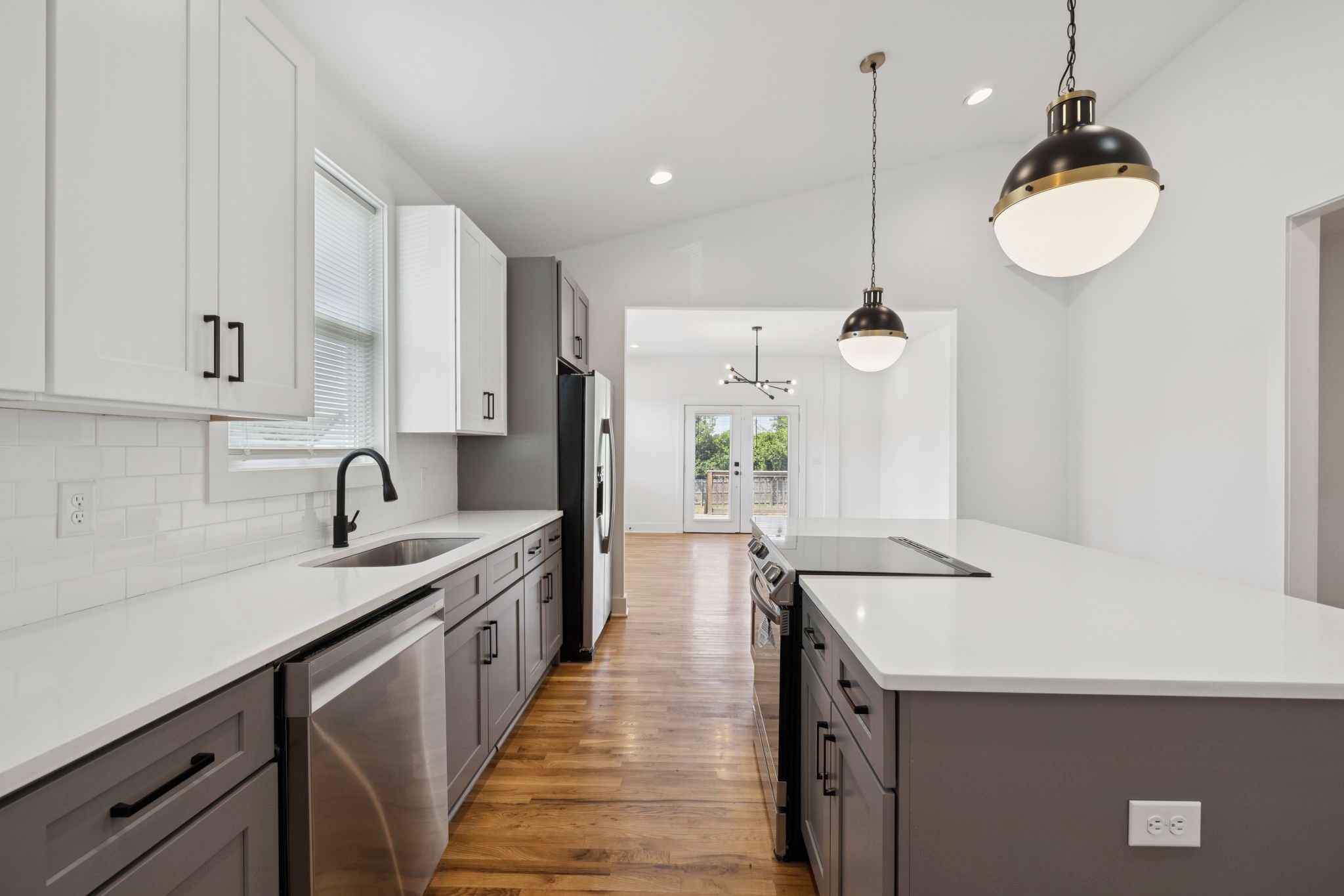 1613 23rd Avenue North Nashville, TN 37208 - Photo 13 of 58 a kitchen with granite countertop a sink a counter space appliances and cabinets