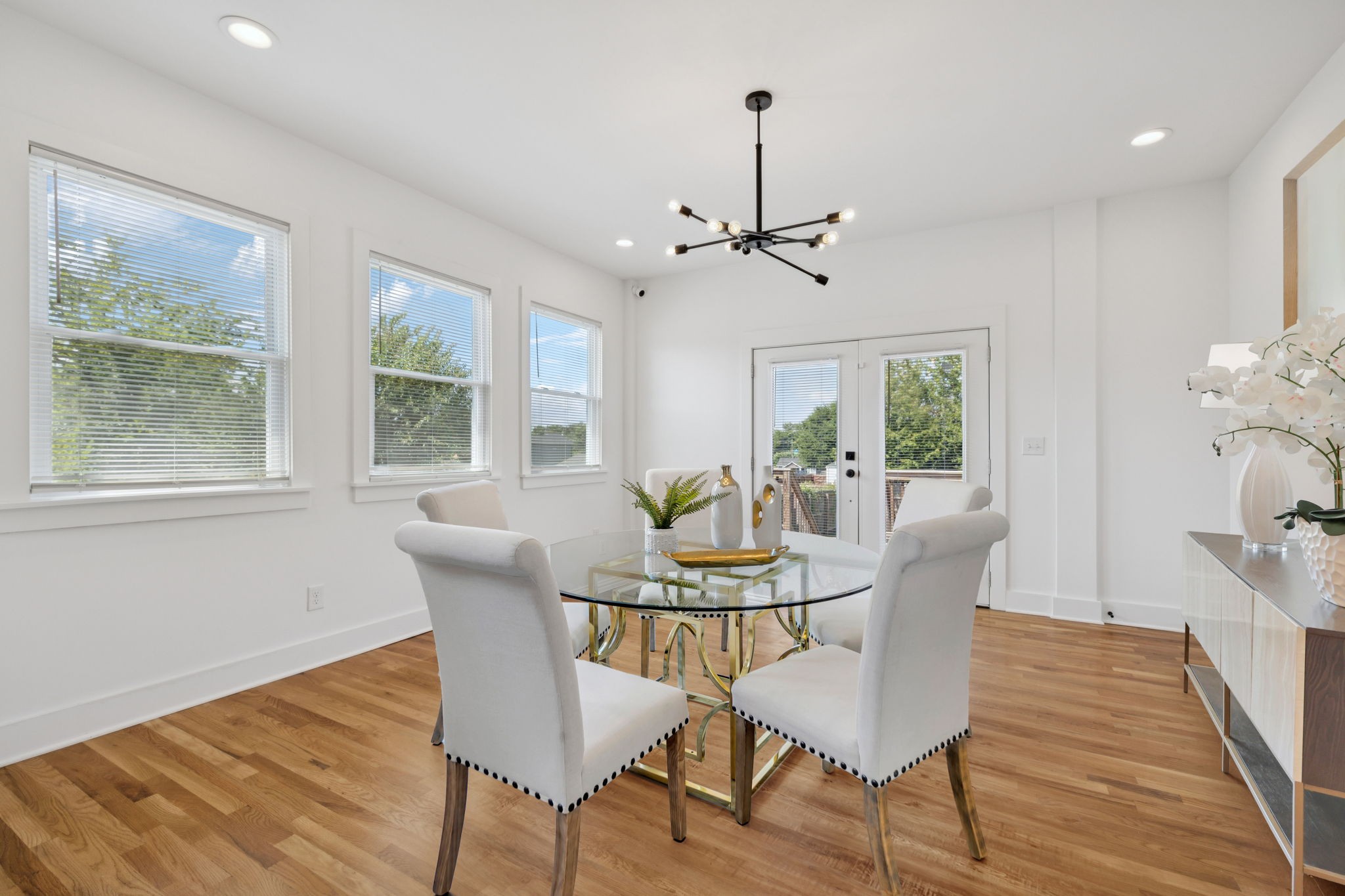 1613 23rd Avenue North Nashville, TN 37208 - Photo 15 of 58 a dining room with furniture a chandelier and wooden floor