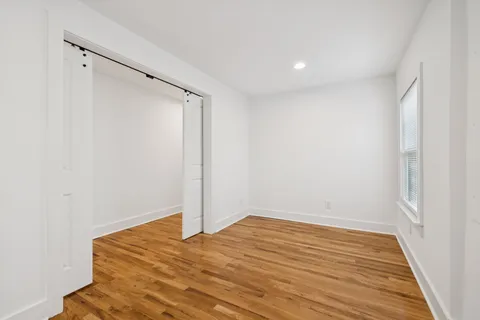 a bathroom with a sink toilet and a mirror