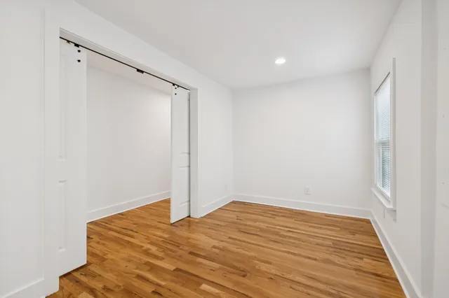 a bathroom with a sink toilet and a mirror
