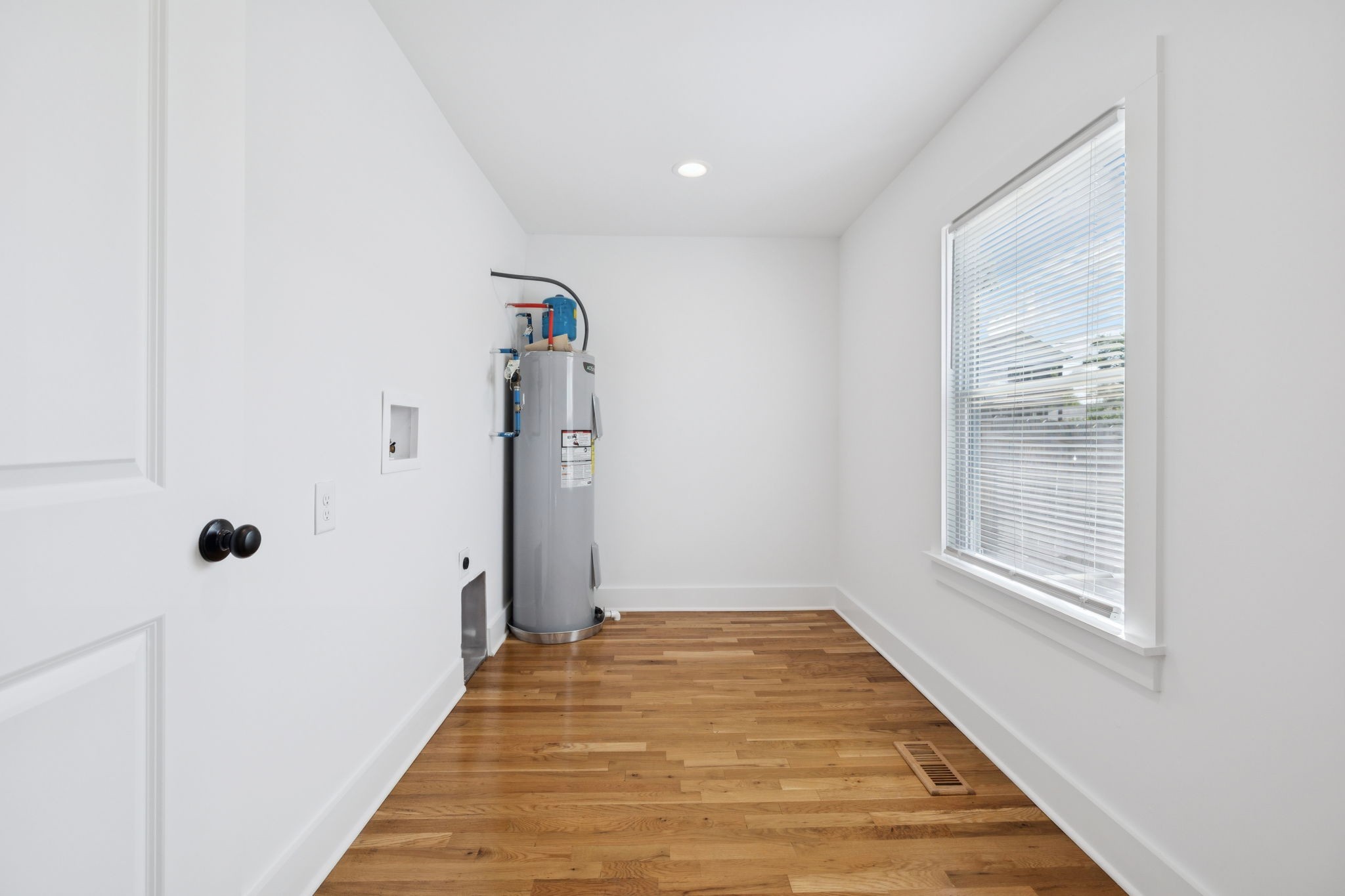 1613 23rd Avenue North Nashville, TN 37208 - Photo 36 of 58 a view of a hallway with wooden floor and a bathroom