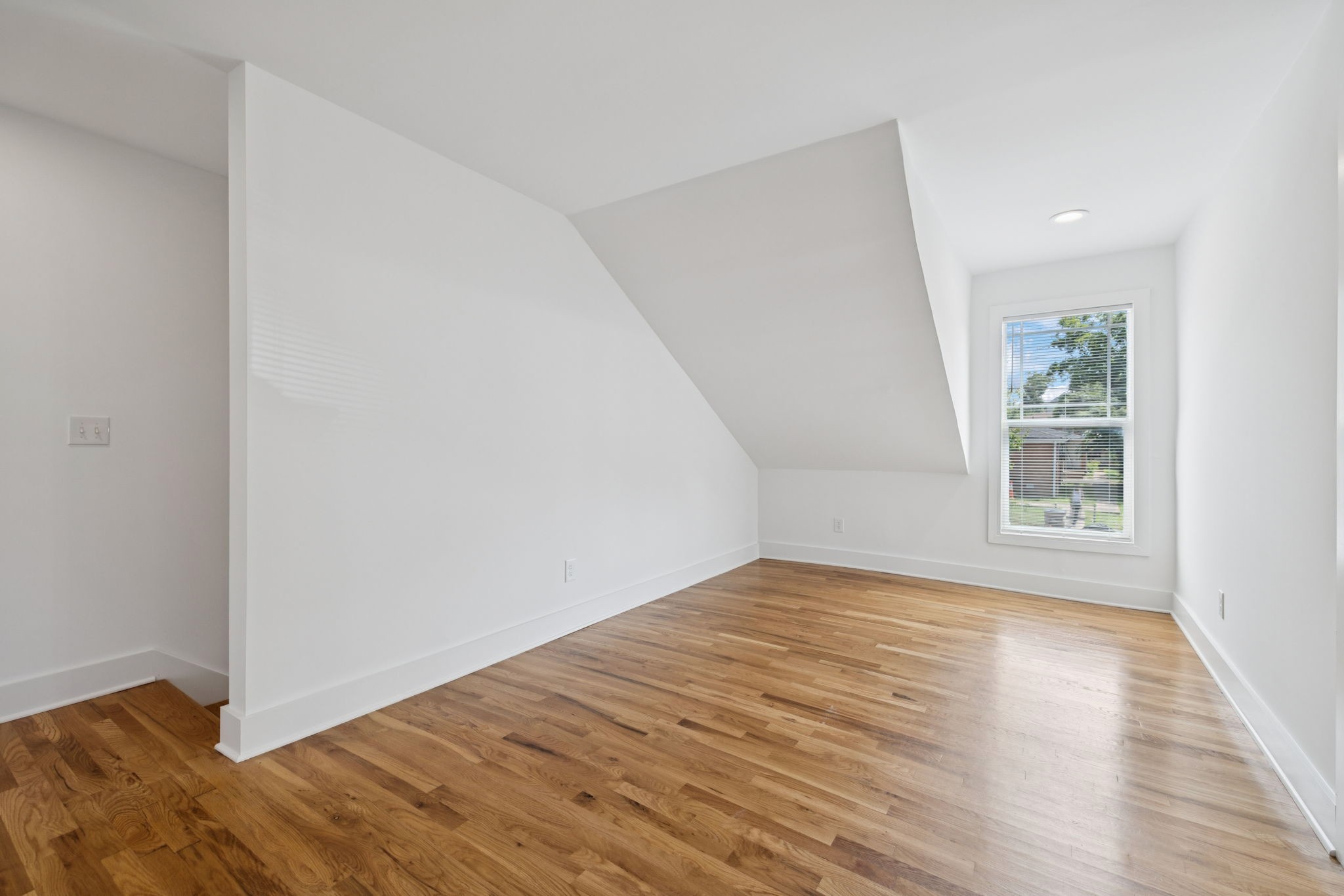 1613 23rd Avenue North Nashville, TN 37208 - Photo 41 of 58 a view of an empty room with wooden floor and a window