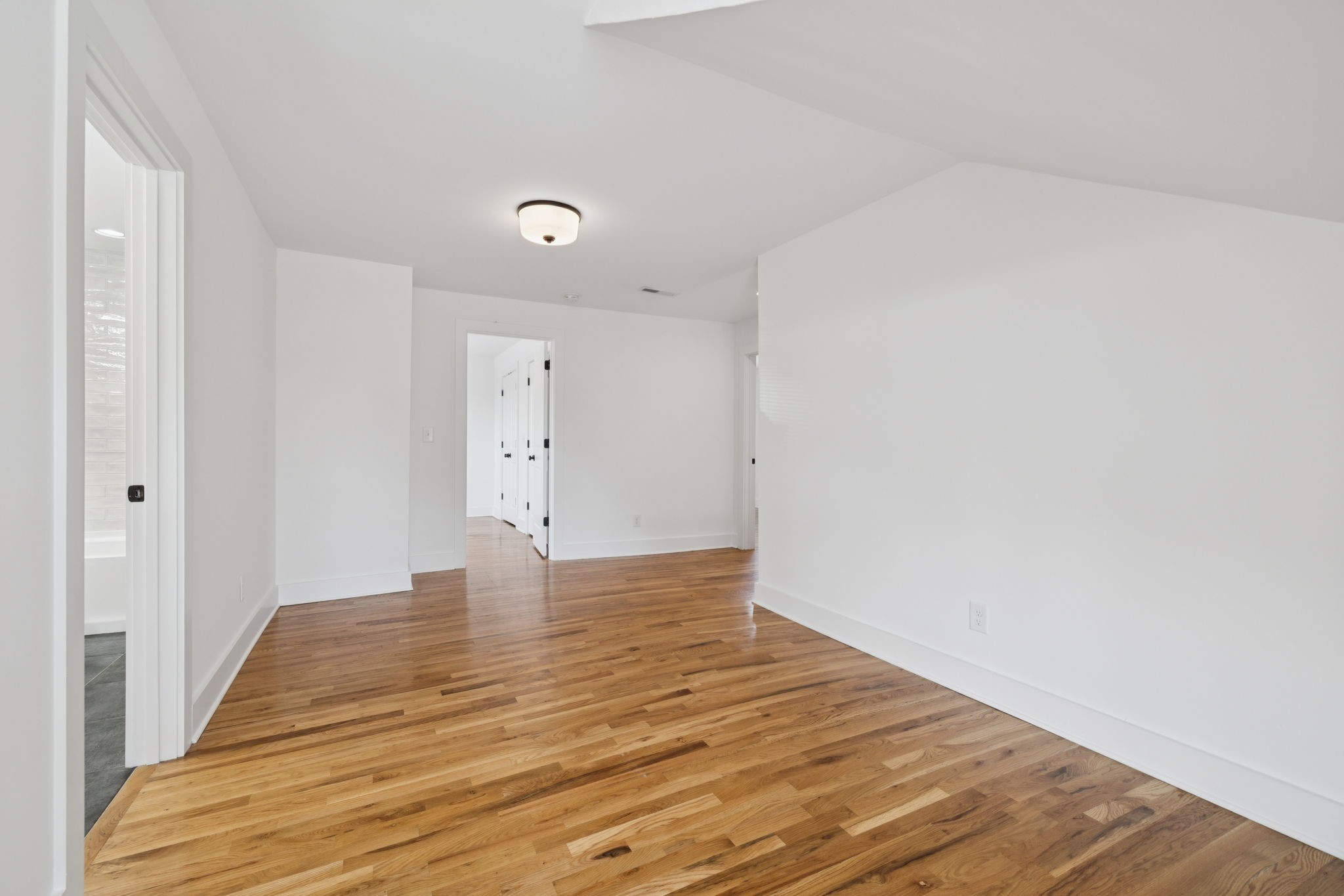 1613 23rd Avenue North Nashville, TN 37208 - Photo 42 of 58 a view of an empty room with wooden floor